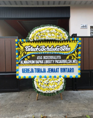 Papan Bunga Duka di Panei